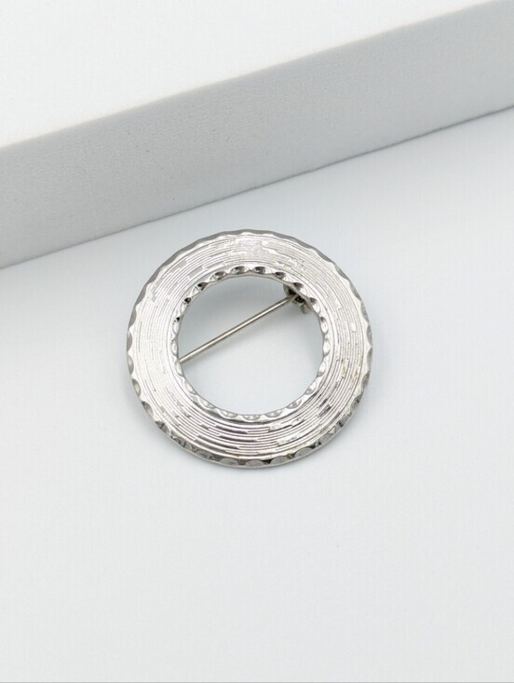 Vintage silver tone textured round open center brooch pin